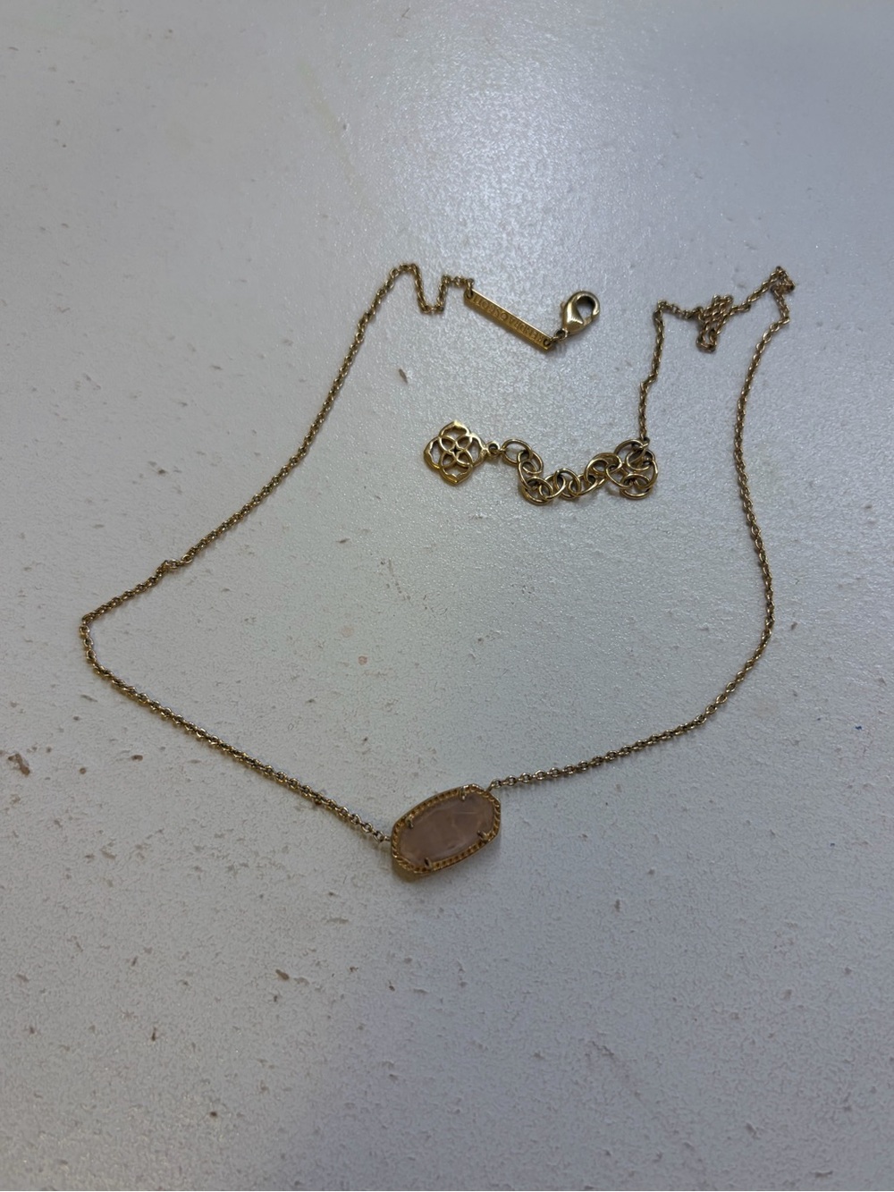 Kendra Scott Gold necklace with pink rose quartz pendant